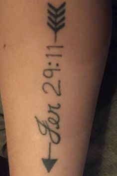 a woman's leg with an arrow and the words love written in cursive writing