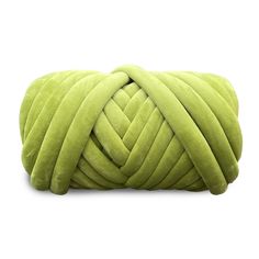 a green pillow with a knot on it