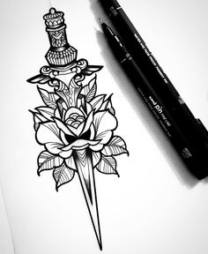 a drawing of a dagger and rose with a crown on it next to a pen