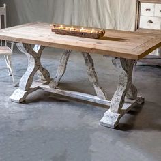 a wooden table with candles on top of it