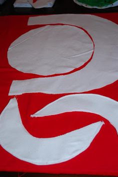 a large red and white sign sitting on top of a table