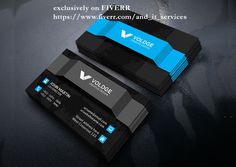 two black and blue business cards sitting on top of a table