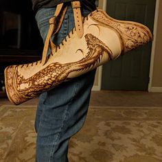 a pair of cowboy boots that have been made to look like alligators on them