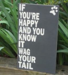 a sign that says if you're happy and you know it wag your tail