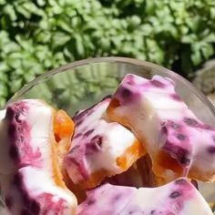 a bowl filled with fruit covered in white icing