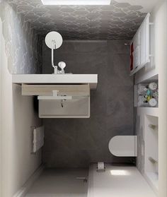 a white toilet sitting next to a sink in a bathroom under a sky light above it