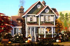 a large house with many windows and lots of plants in front of it, surrounded by fall foliage