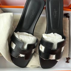 Selling Brand New Oran Slides Black With White Stitching Size 41.5 Purchased In America Will Include Box To Dust Bags And Herms Bag As Well Black Flat Heel Calf Leather Sandals, Classic Black Flat Heel Sandals, Hermes Oran Black, Oran Black, Hermes Slides, Black Slides, Hermes Shoes, Hermes Oran, Hermes Bag