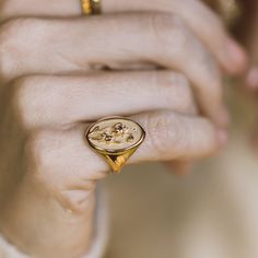 DESCRIPTION The March Birth Flower Signet Ring features a daffodil, blooming at the dawn of spring. Shaped like a vintage saint charm with a detailed relief carving and sparkling diamond, this statement ring is handmade with love in Los Angeles. Show love to your favorite March baby (or yourself!) with this perfect addition to your everyday collection. Note that this piece is handmade to order. Please allow for a 3-4 week lead time as we craft this special ring. Due to the custom nature of this March Birth Flower, March Birth Flowers, March Baby, Signet Rings Women, Relief Carving, Organic Cleaning Products, Baguette Ring, Special Ring, Rainbow Bracelet