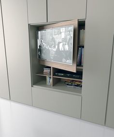 an entertainment center with a flat screen tv in it