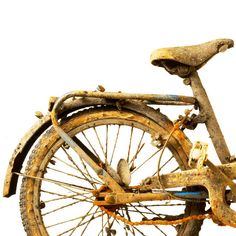 an old rusty bicycle is shown against a white background