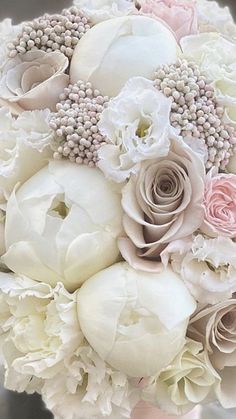 a bridal bouquet with white and pink flowers