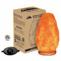 an orange himalayan salt lamp sitting in front of a box