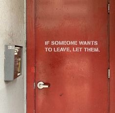 a red door with the words if someone wants to leave, let them