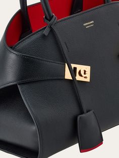 Hug handbag (S) - Women - Salvatore Ferragamo US Ferragamo Handbags, Black Leather Tote Bag, Leather Tag, Handle Bag, Leather Tote Bag, Hand Bags, Leather Top, Hobo Bag, Salvatore Ferragamo