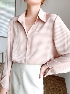 Take charge of your style and create the look you desire with our Vertical Striped Silky Blouse. This versatile blouse offers a slim-fit, making it your go-to piece for an array of fashion-forward outfits. Featuring long sleeves, a classic collar, and a subtle vertical striped pattern, this blouse pairs well over your solid tees and turtlenecks or shines as a stand-alone piece tucked into your favorite trousers. Vertical Striped Shirt, Striped Shirt Women, Silky Blouse, Chic Top, Women Blouses, Loose Shirts, Loose Blouse, Spring Shirts, Elegant Shirt