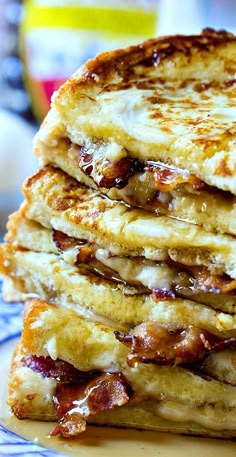 a stack of pancakes sitting on top of a blue and white plate