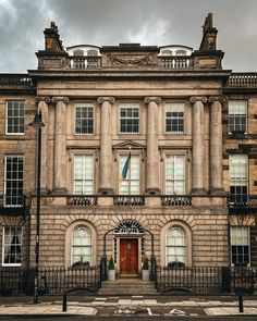 an old building with a flag on the front