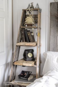 an old ladder is used as a shelf for books