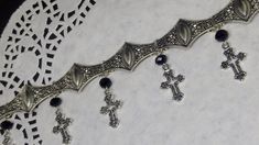 Victorian Gothic metal choker with hollow crosses and black crystal beads, ornate metal necklace, Victorian jewelry, Gothic jewelry A beautifully ornate gothic silver metal choker with Victorian hollow cross charms and black faceted crystal beads. It measures approx. 11 inches in length and has lobster clasp fastening and an extension chain, so that it can be adjusted to fit the neck. The choker is made up of 7 silver toned metal ancient style sections that have intricate detailing. A marvelous Gothic Silver Metal Body Jewelry, Silver Gothic Metal Body Jewelry, Silver Gothic Body Jewelry, Gothic Metal Choker For Festivals, Gothic Silver Jewelry For Festival, Gothic Silver Festival Jewelry, Gothic Nickel-free Silver Body Jewelry, Handmade Silver Gothic Choker, Nickel-free Gothic Silver Body Jewelry