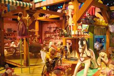 an assortment of figurines on display in a store