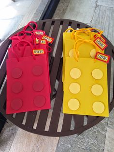 two bags made to look like legos sitting on a table