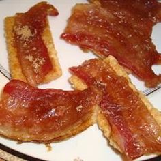 bacon on toasted bread sitting on a plate