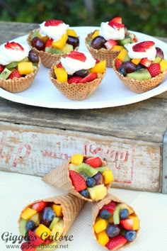 some fruit cups are on a white plate