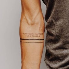 a man with a tattoo on his arm that says everything happens for a reason,