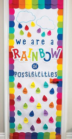 we are a rainbow of possibilities bulletin board on the door to an elementary school classroom