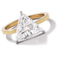 a gold and white ring with a princess cut diamond