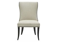 the side view of a beige upholstered chair with black legs and nail polishing