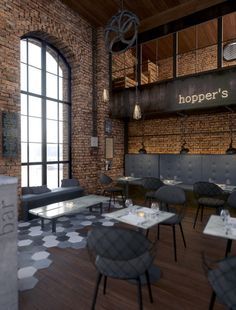 the interior of a restaurant with tables, chairs and benches in front of large windows