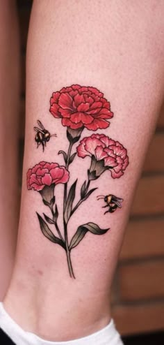 a woman's thigh with flowers and bees on it