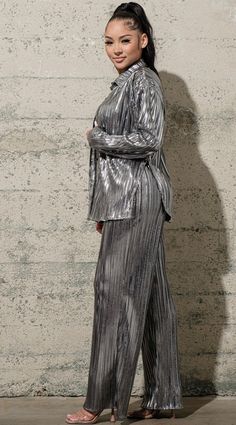 Show up to the holiday party slaying in this three piece pleated set. The long sleeve top and pants have a loose fit, and the bralette is lightly padded. A definite great holiday look❣️. 95% Polyester 5% Spandex Holiday Season Outfits, Metallic Suit, Jungle Disco, True Winter Palette, Nye 2025, Christmas Day Outfits, Human Design Reflector, Pleated Set, Stylish Winter Coats