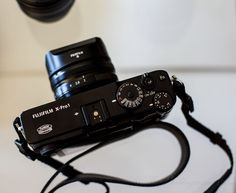 a black camera sitting on top of a table