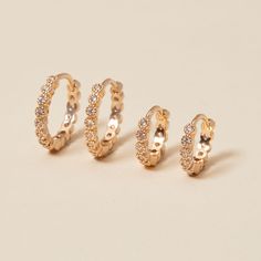 A timeless hoop with an added sparkle. Our Crystal Eternity Mini Hoop Earrings are set with dazzling crystals that will shine bright in any earring stack. Finished with a hidden hinge clasp, these hoops will add the perfect amount of dazzle for any occasion.&nbsp;18K Champagne Gold Plated or 925 Sterling SilverDiameter: 1.05cmThickness: 1.70 mmWidth: 2mmSent with love in a complimentary gift box Mini Hoop Earrings, Box Delivery, Champagne Gold, Shine Bright, Layering Pieces, Hinges, Gold Plate, Gift Box, Hoop Earrings