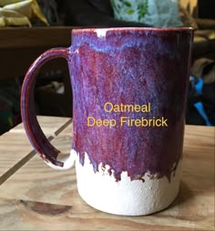 a purple and white coffee mug with the words oatmeal deep fire brick on it