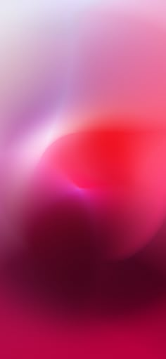 an abstract blurry background with red and pink colors