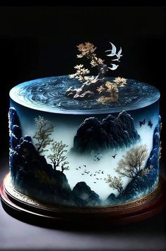 a cake decorated with an image of trees and birds