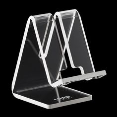 an acrylic display stands on a black background with no one in the photo