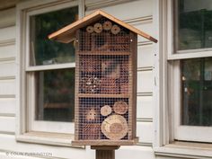 a bird house made out of wood and wire