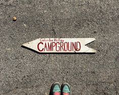 a person standing in front of a sign that says columbia valley camperround