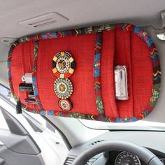 the interior of a car with a red purse on it