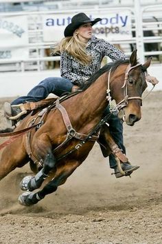 a woman riding on the back of a brown horse