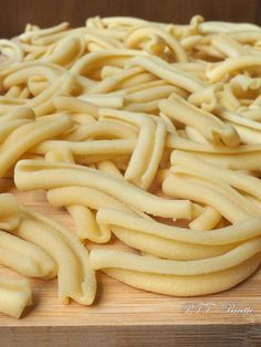 some kind of food that is on a cutting board and ready to be cut into smaller pieces