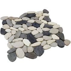 a pile of rocks sitting next to each other on top of a white flooring