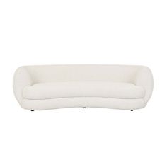 a white couch sitting on top of a white floor