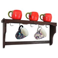 Spanish Colonial Wood Coffee Mug Rack / Wall Shelf Hand-carved pine wall shelf for cups and mugs, Spain, 1940s-1950s This handcrafted wooden shelf has 5 hooks to hang cups and an upper shelf to place glasses or small dishes. It has a rustic finish and Spanish colonial accents. It will be a nice an addition to a countryside or cottage house kitchen or pantry roomor adding a Spanish taste to or any classical, contemporary or rustic decoration. Ceramic mugs are for demonstration only. Overall measures: 55 cm W x 25 cm H x10,5 cm D Cottage House Kitchen, Rustic Decoration, Small Dishes, Pine Walls, Wooden Wall Shelves, Storage Cabinet Shelves, Wood Wall Shelf, Wooden Shelf, Mug Rack