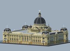 an architectural model of a building with a dome on top and two flags flying from the roof